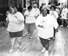Photo of an aerobics class of large women exercising